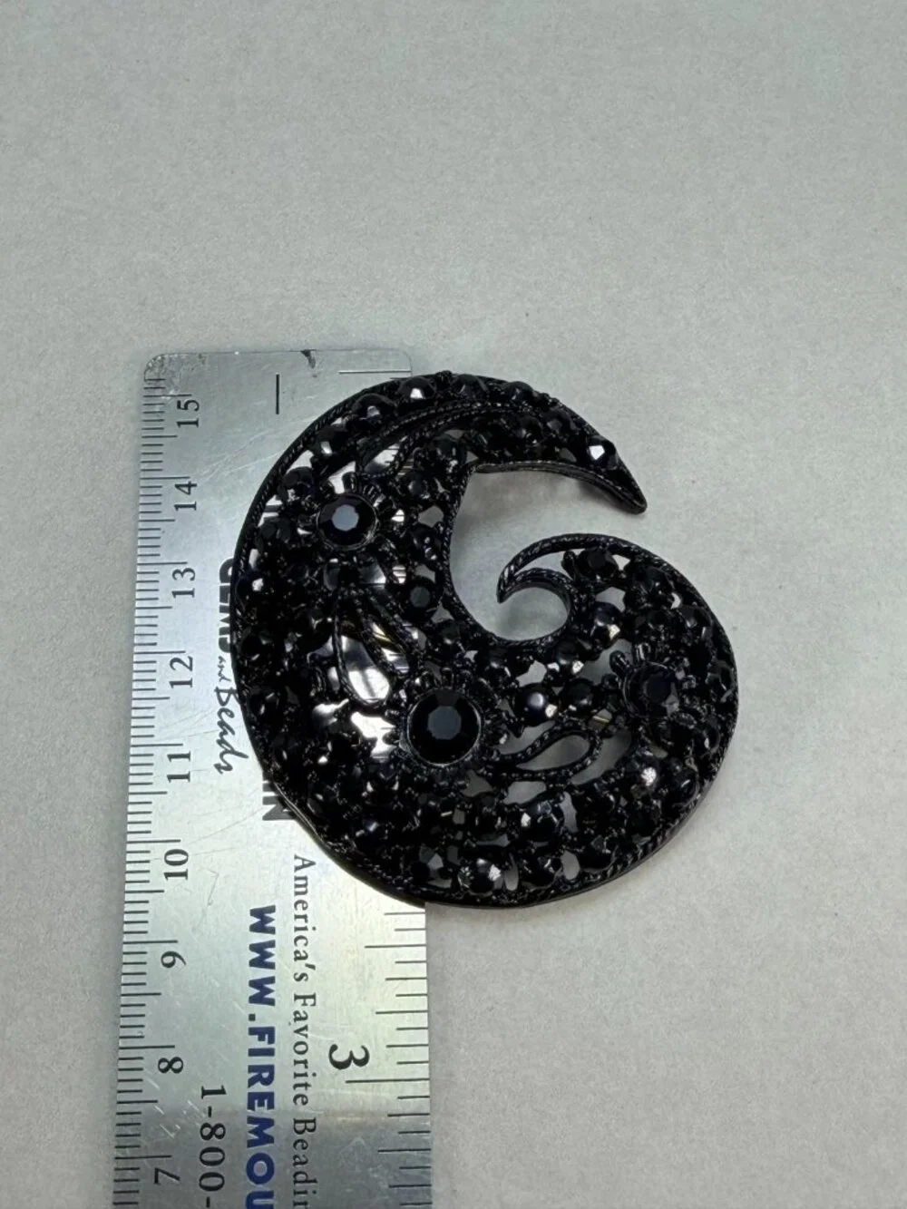 Vintage M.JENT Black Rhinestone Swirl Brooch Gold Tone Openwork Statement Pin